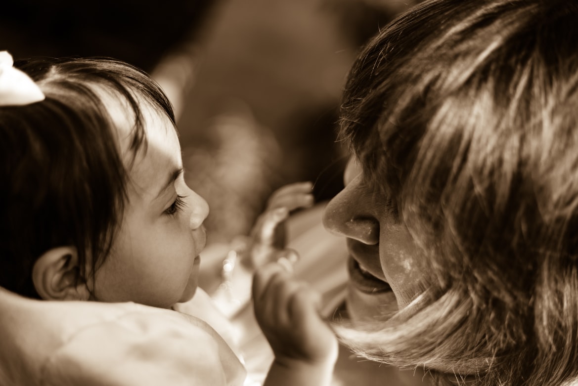 Mother reading a story to her child at home